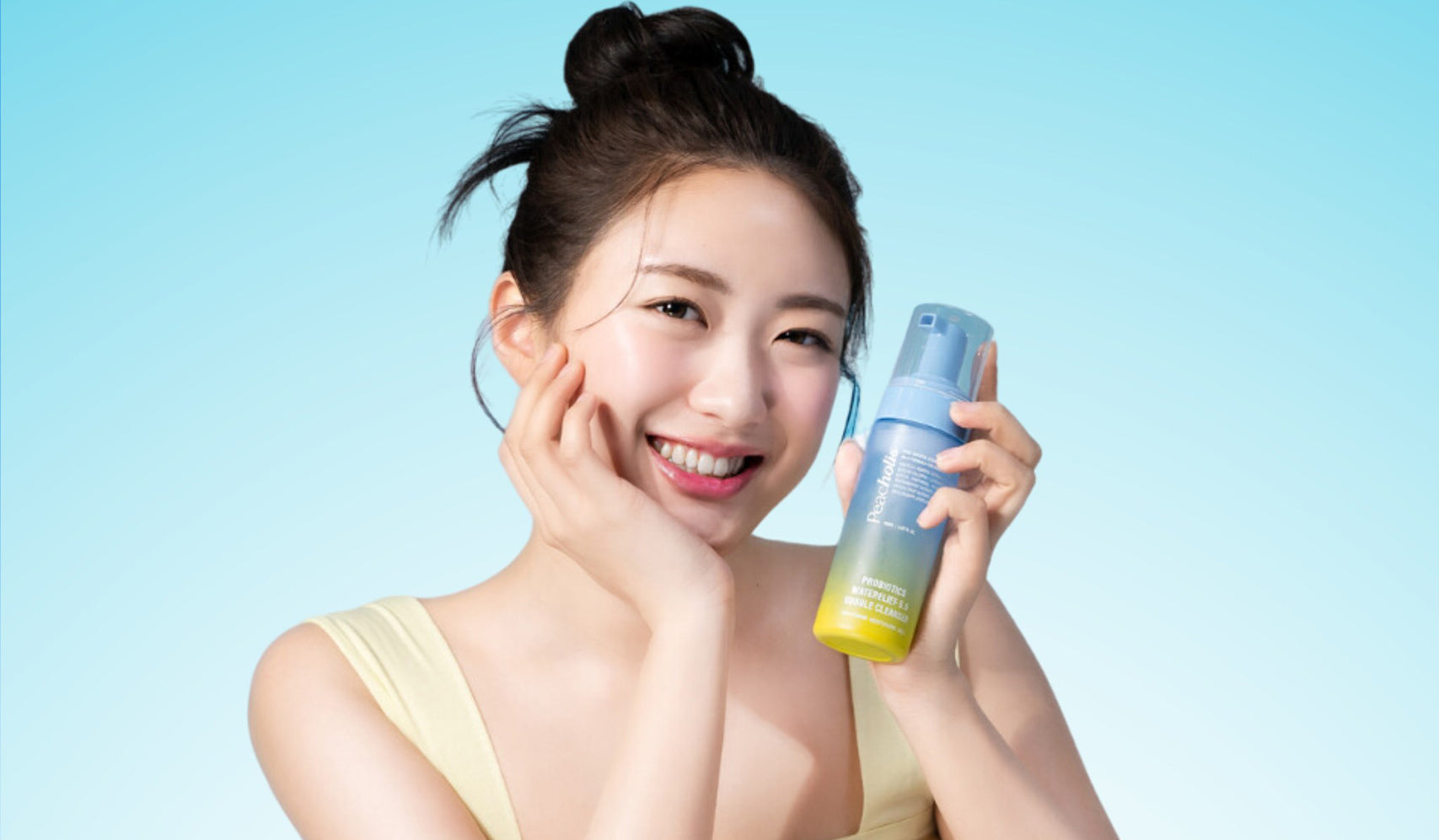 Elevate Your Skincare Game with PEACHOLIC’s Innovative Products featuring a smiling woman holding PEACHOLIC skincare.