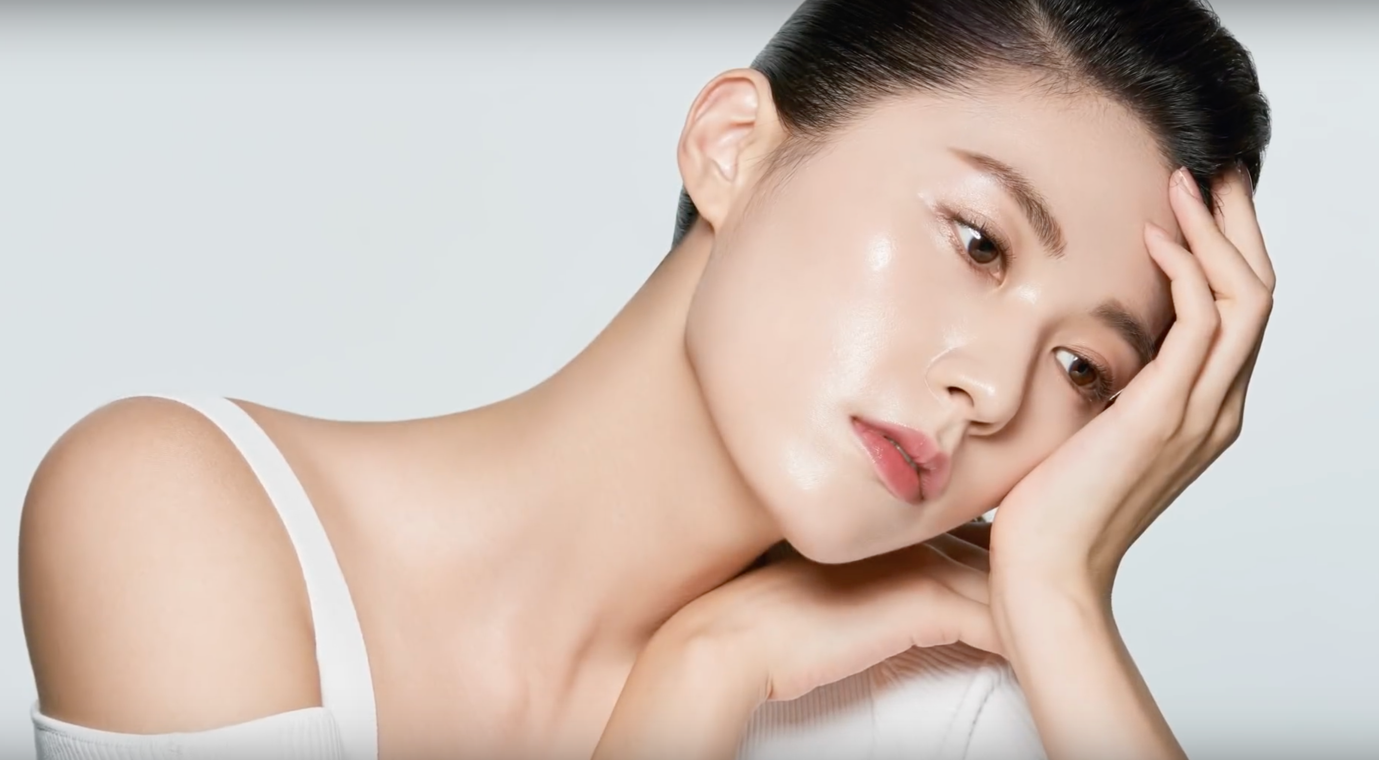 Model showcasing Unveiling the Timeless Elegance of JUNG SAEM MOOL: Redefining Beauty in Korean Skincare with radiant skin.