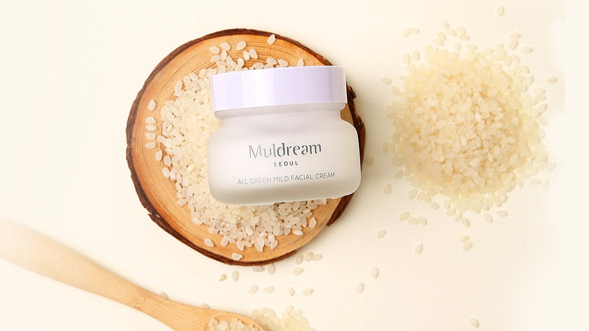 Embracing Dreamy Skincare: Unveiling the Magic of MULDREAM in Korean Beauty, featuring a facial cream with rice grains.