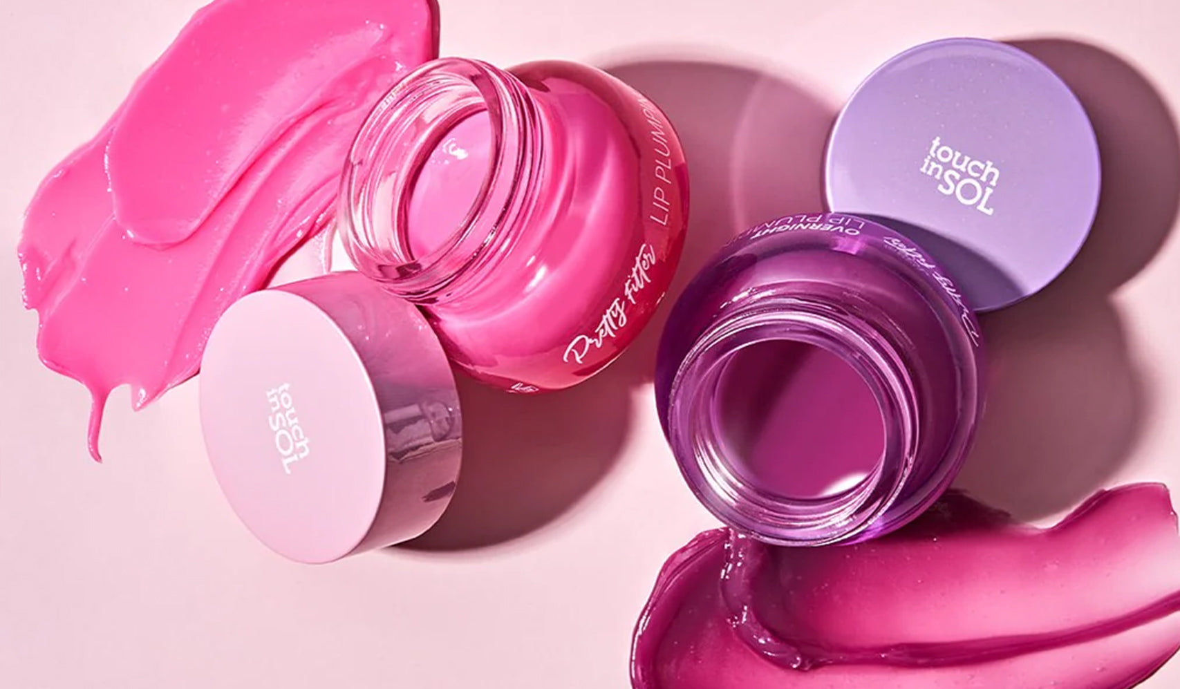 Explore the Excellence of TOUCH IN SOL: Korean Skincare and Makeup for Every Style with vibrant lip balms in pink and purple hues.