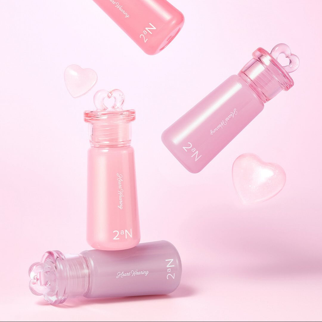 2AN Heart Wearing Liquid Cheek 4.4g bottles on pink background with hearts