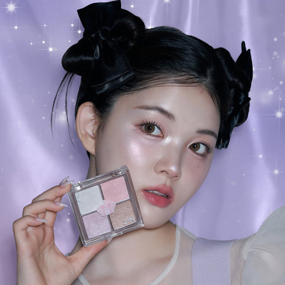 Model holding 2AN Jelly Glow Highlighter Palette 10.8g against a purple backdrop, highlighting its shimmery shades.