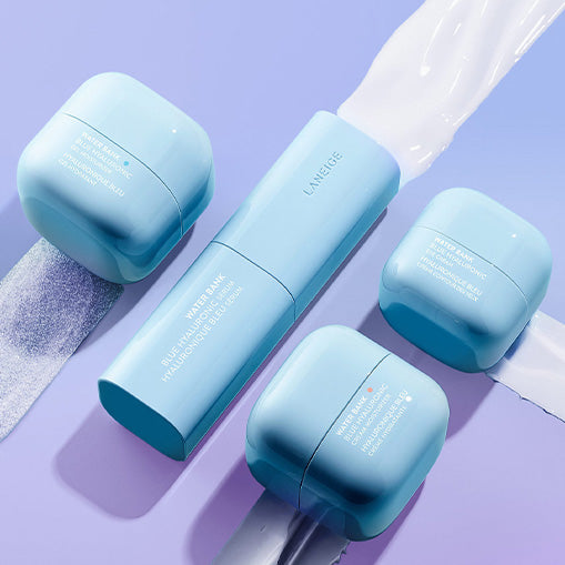 Laneige Water Bank skincare products on purple background, featuring cream jars and a lotion bottle, offering hydration and moisture.