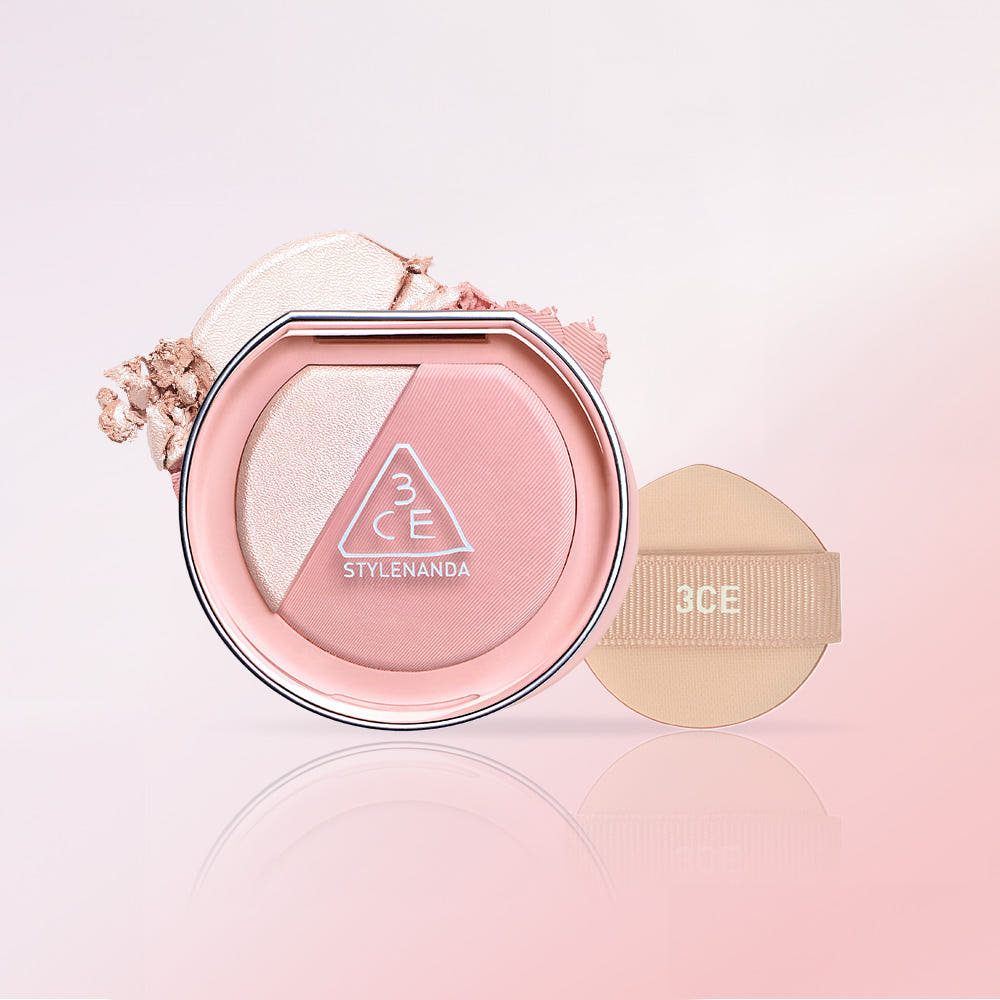 3CE Blushlighter in compact with cushion applicator on a light pink background