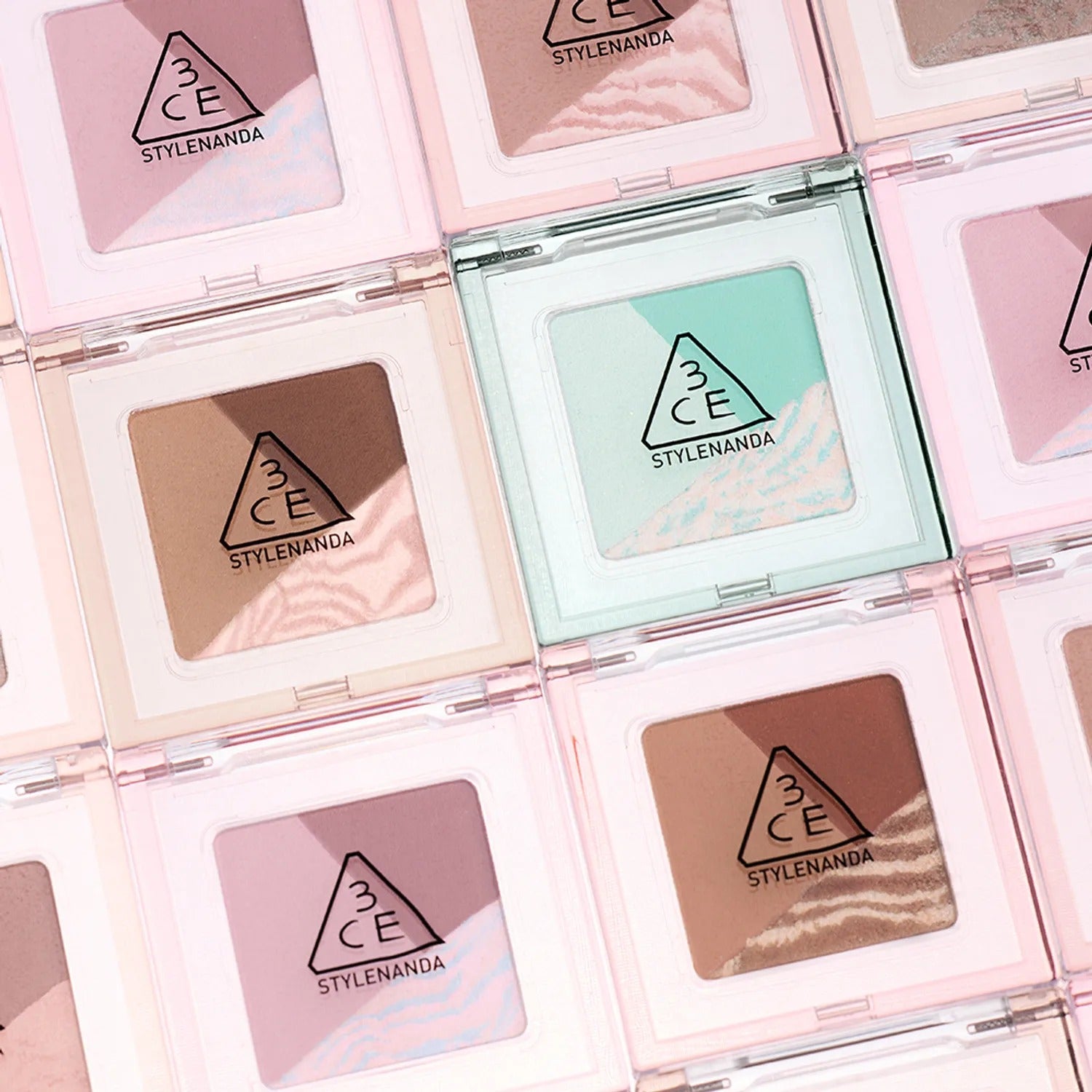 A collection of 3CE Color Grid Eyeshadow palettes showcasing various colors in stylish packaging.