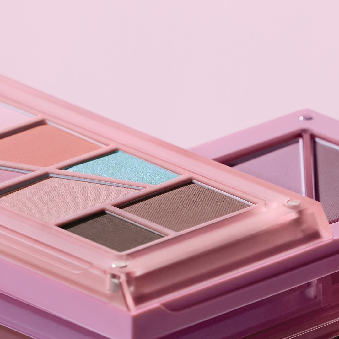 Close-up of 3CE Layer It All Eye Palette 7.5g featuring vibrant eyeshadow colors in a stylish pink case.