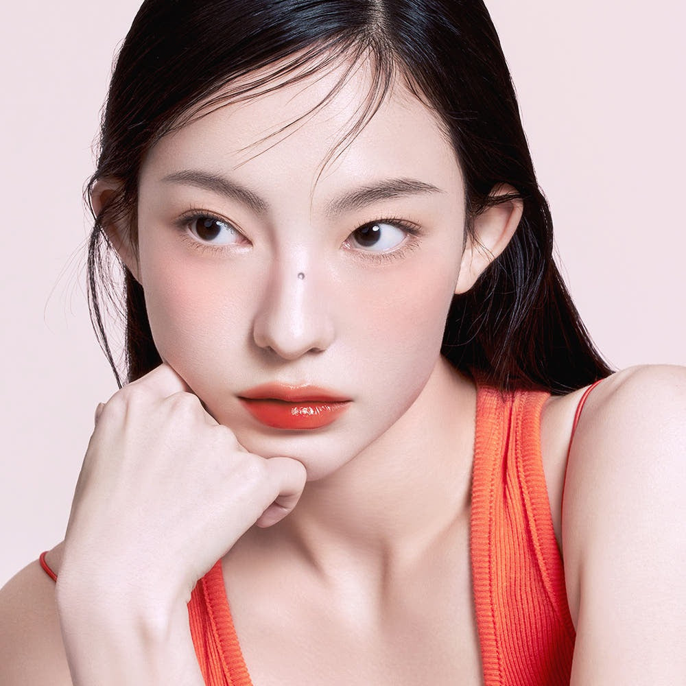Model wearing 3CE Lazy Pop Lip Stain showing bold lip color and smooth finish