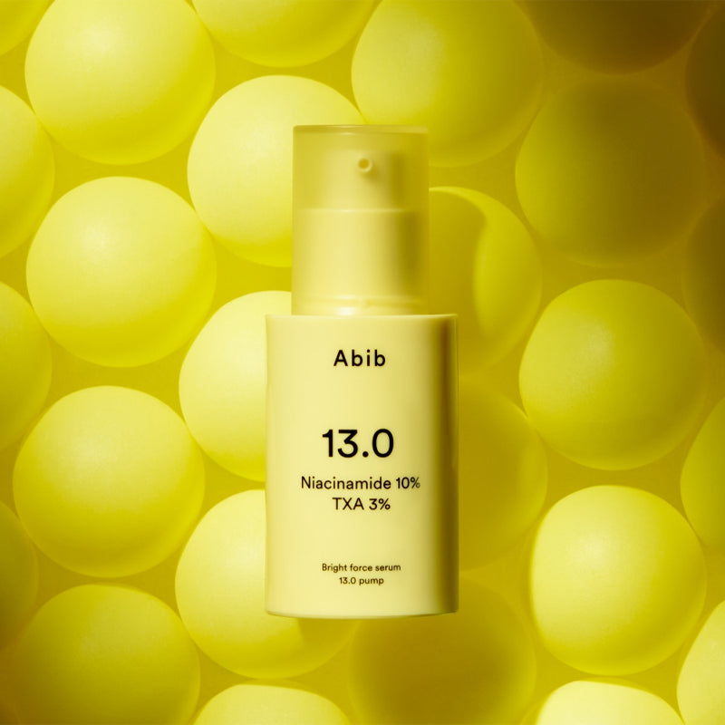 ABIB Bright Force Serum 13.0 Pump 30ml bottle on a yellow background