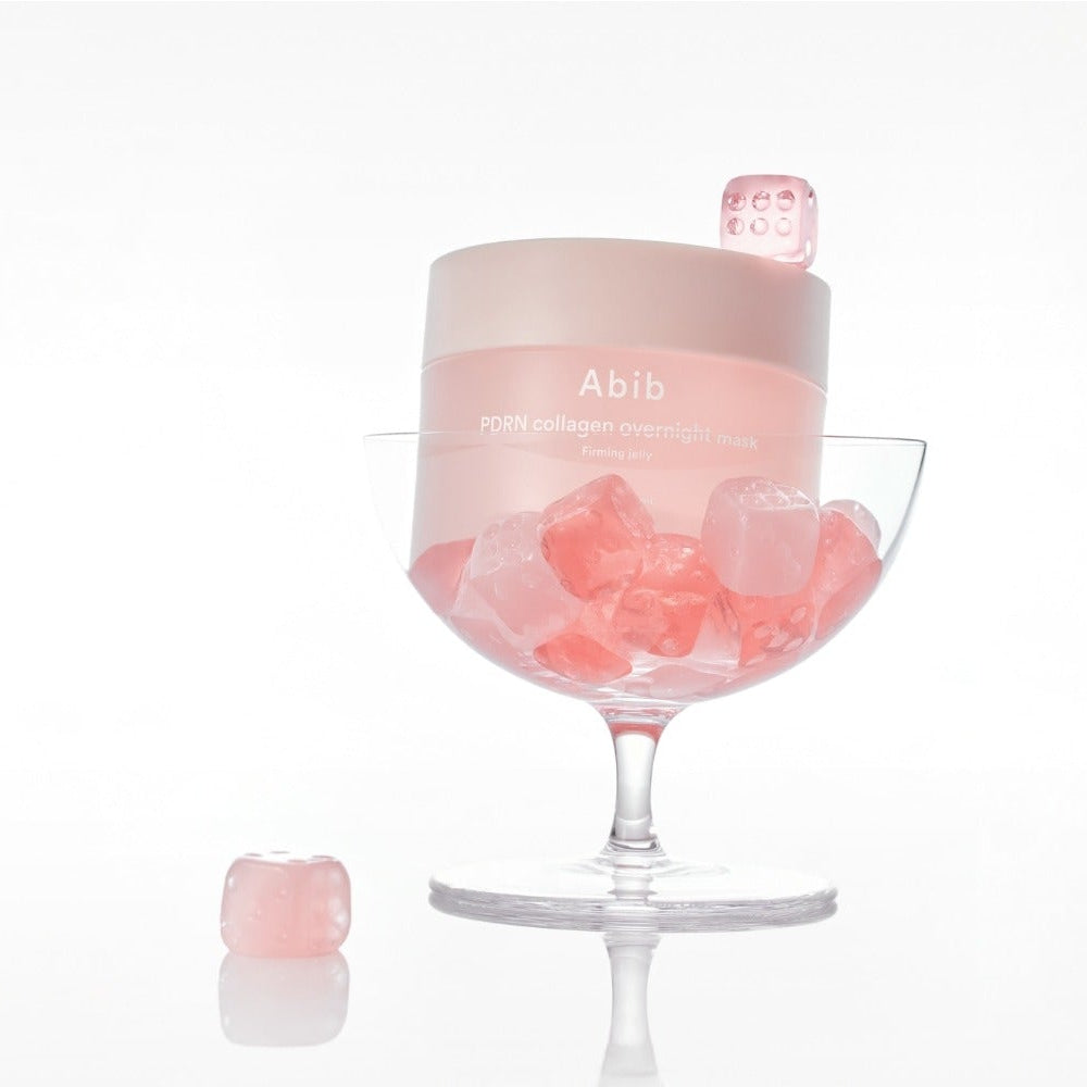 ABIB PDRN Collagen Overnight Mask Firming Jelly 80ml in a glass with pink cubes, showcasing luxurious skincare product.