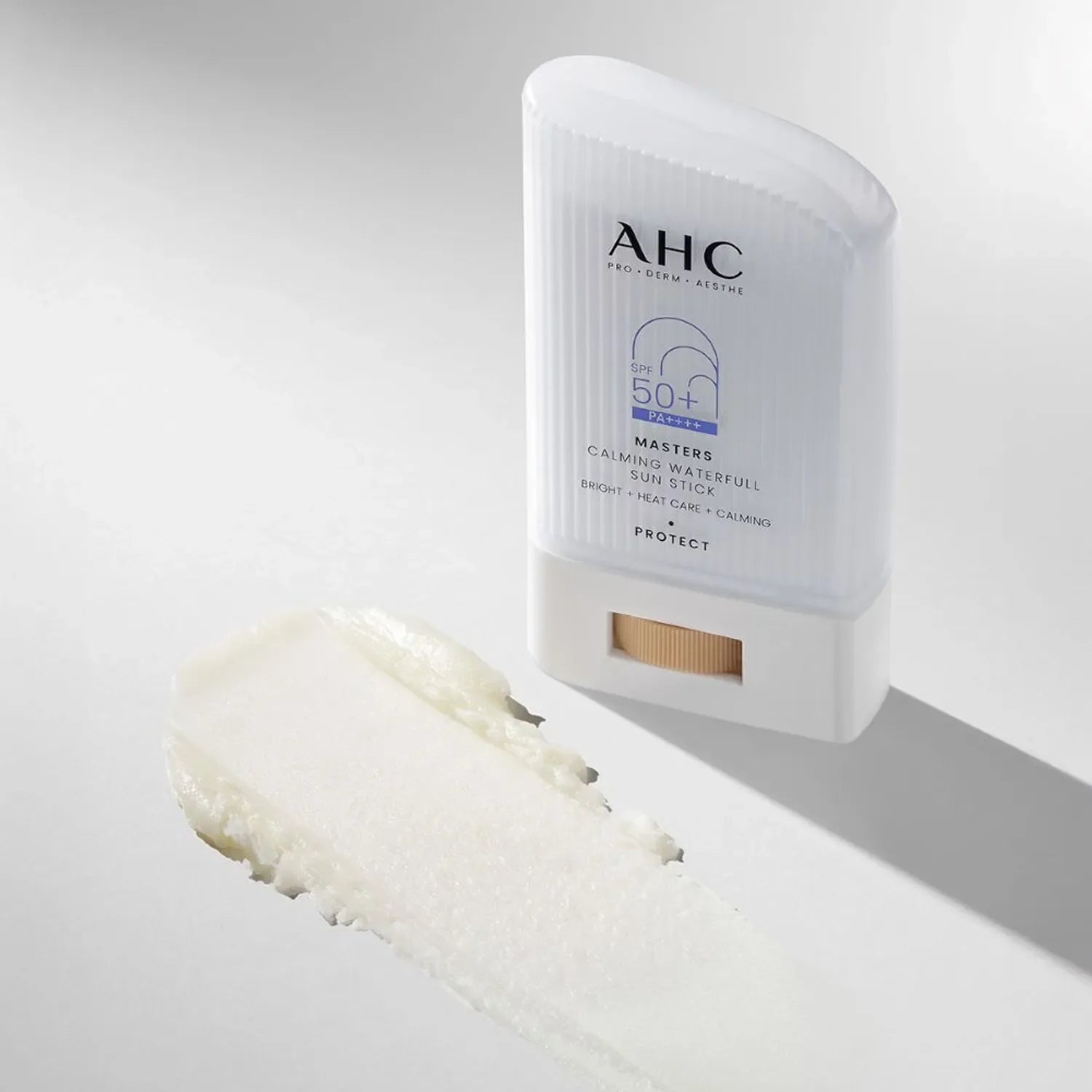 AHC Masters Calming Waterfull Sun Stick 22g SPF 50 formula displayed next to the product, highlighting texture and packaging.