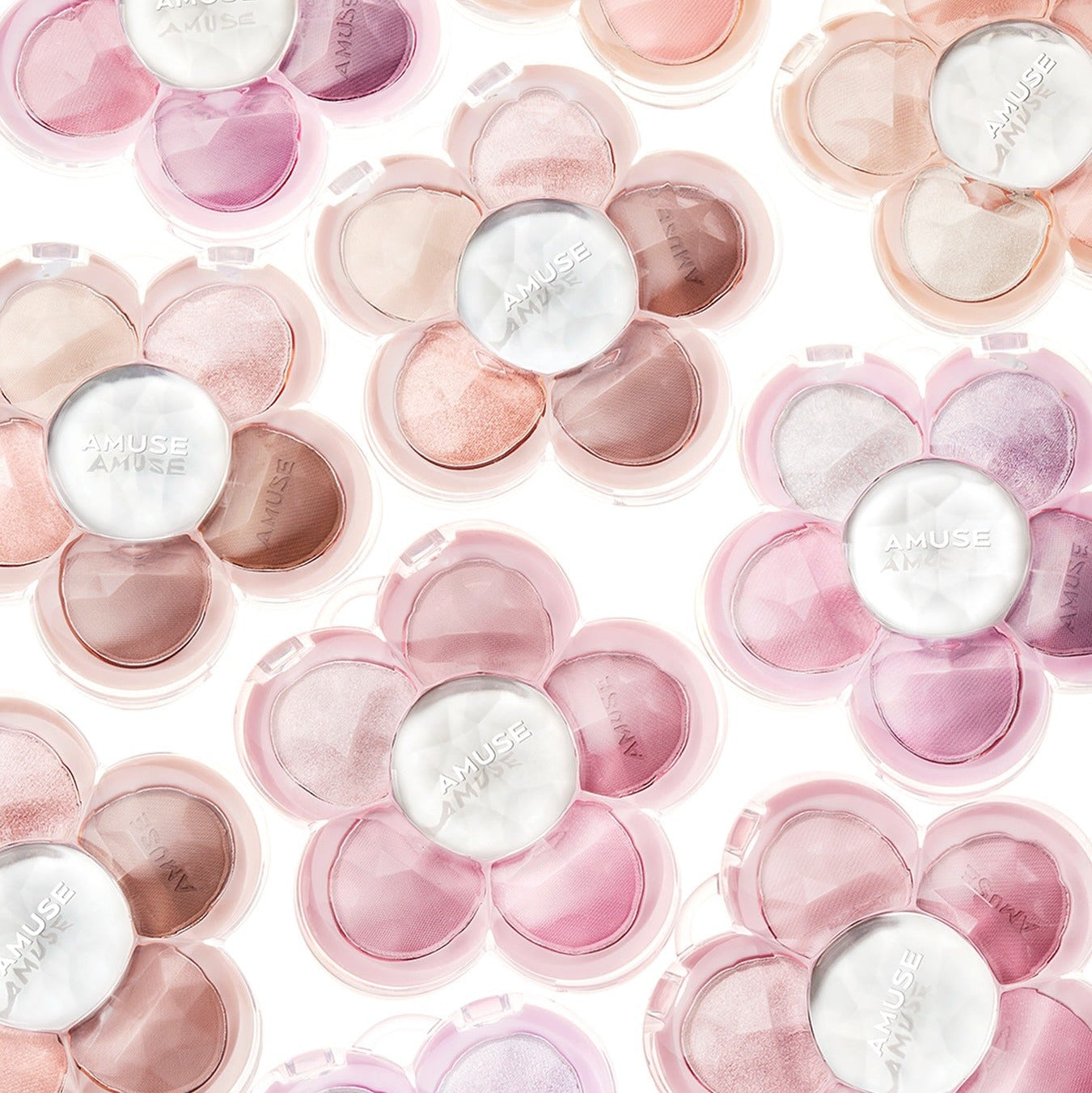 Various AMUSE Flora Eye Palette floral-shaped compacts with pink, nude, and neutral shades.