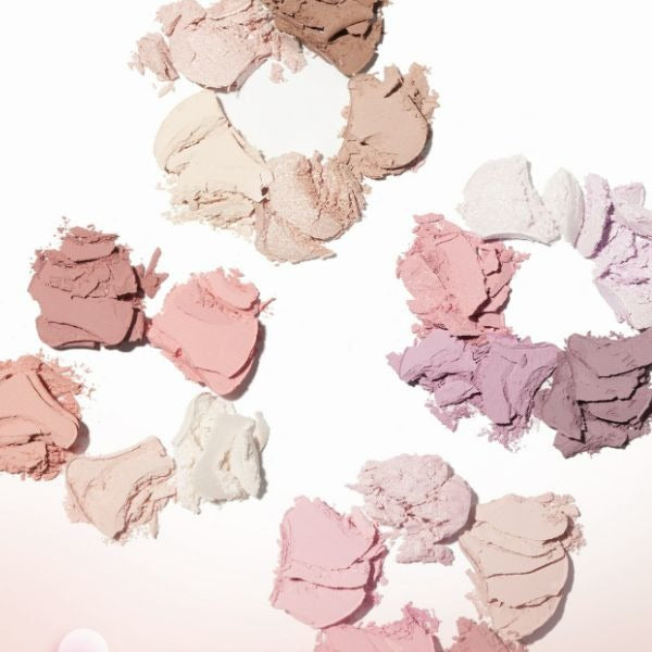 AMUSE Flora Eye Palette with a variety of soft, pastel eyeshadow shades carefully arranged on a white background.