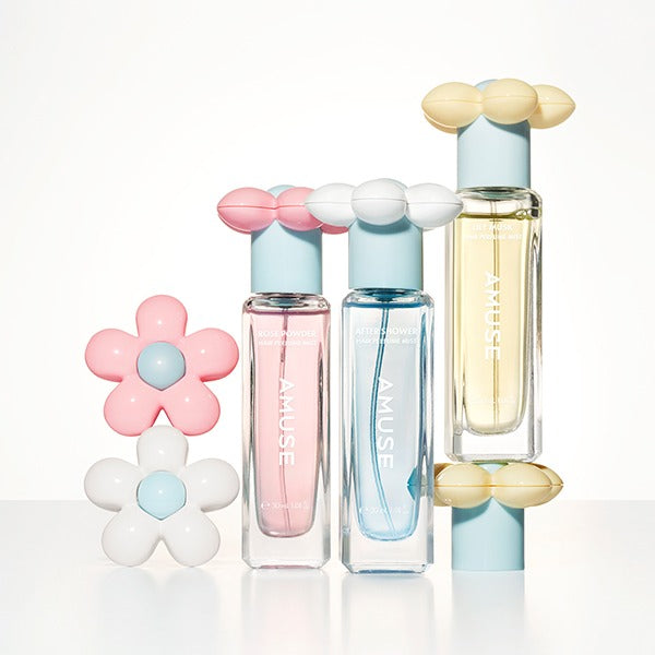 AMUSE Rose Powder Hair Perfume Mist 30ml bottles with flower decorations on a white surface.