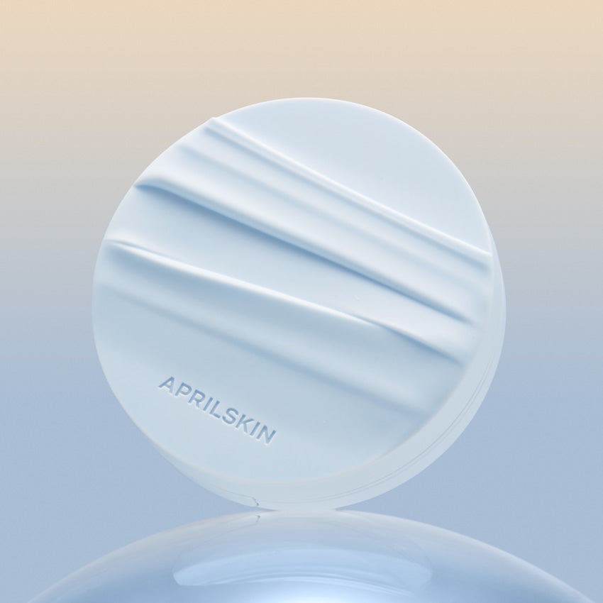 APRIL SKIN Glowing Matt Cushion in a sleek design against a gradient background