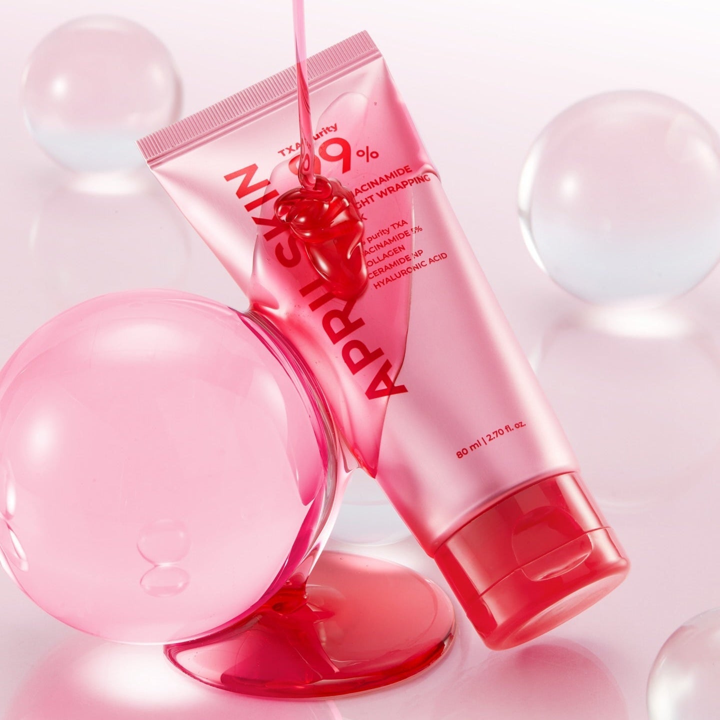 APRILSKIN TXA Niacinamide 99 Deep Cleanser 120g in a dynamic pink package with globules in background.