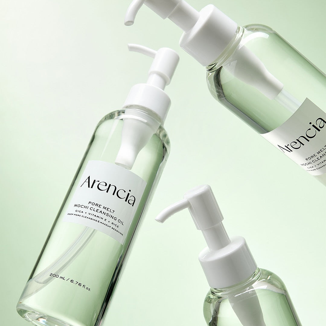 ARENCIA Pore Melt Mochi Cleansing Oil 200ml bottles on a green background