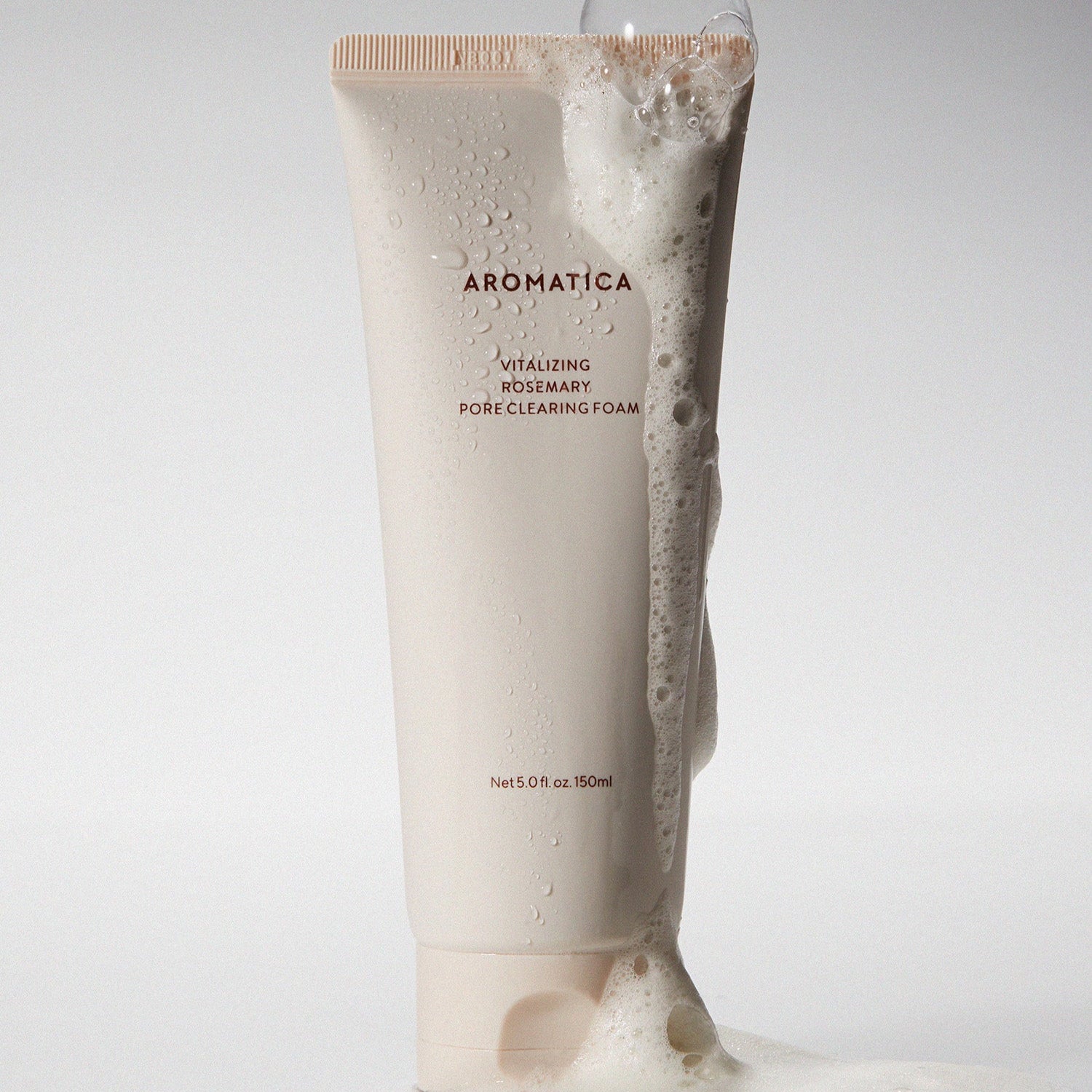 AROMATICA Vitalizing Rosemary Pore Clearing Foam 150ML with foamy texture spilling over the tube