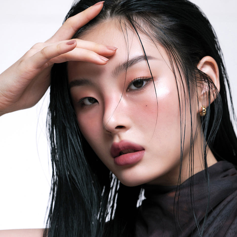 Model wearing ARTESINSA Silky Blur Tints showcasing makeup look with glowing skin and sleek hair style.