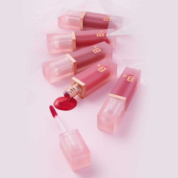 BANILA CO Water Drop Veil Tint in elegant packaging, featuring multiple shades and open tube displaying product texture.