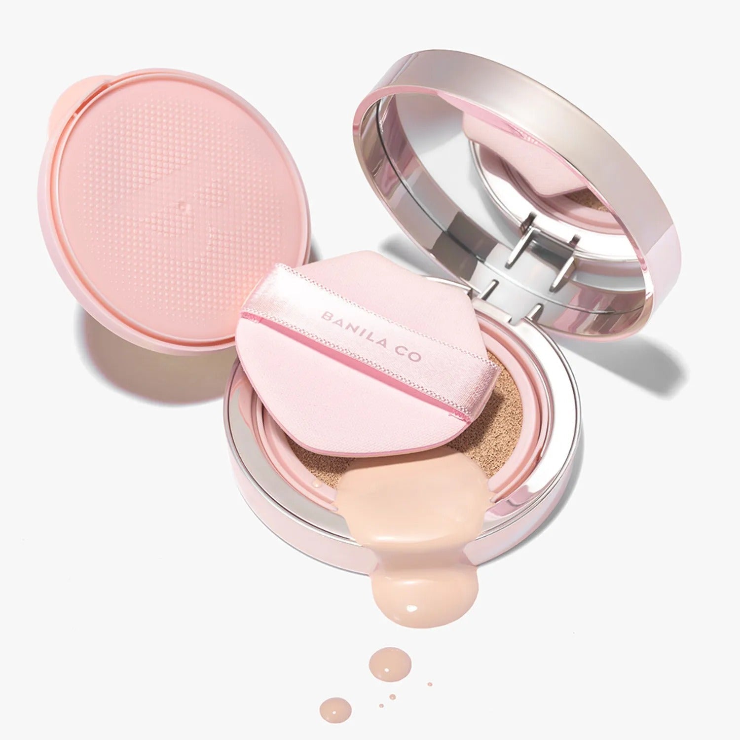 BANILACO Essence Skin Pink Cushion makeup compact with applicator and liquid foundation spill on white background