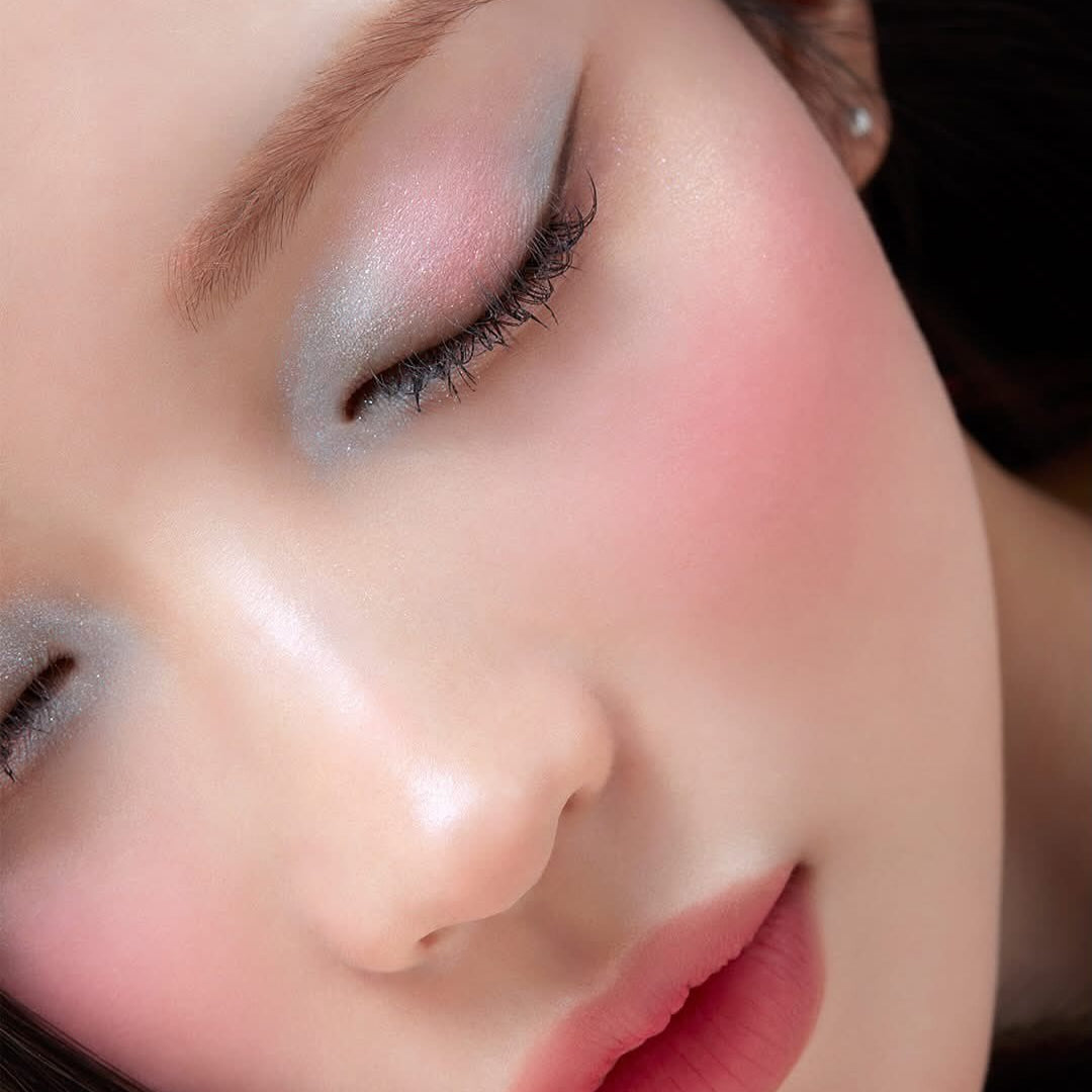 Model wearing BANILACO Hyper Holobeam Eye Glitter showcasing shimmer eyeshadow and soft pink blush.