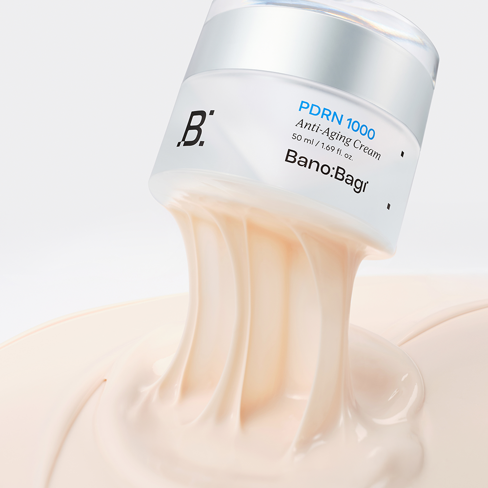 BANOBAGI PDRN 1000 Anti-Aging Cream 50ml jar with cream texture flowing out, highlighting luxurious skincare product