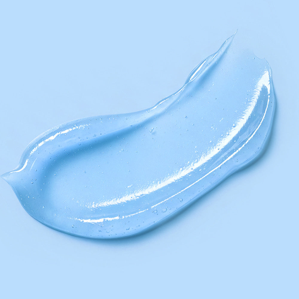 Close-up of BARULAB Hyaluronic Panthenol Moisturizing Lip Serum 10g texture on light blue background
