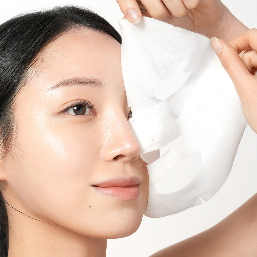 Woman applying BARULAB Rice Makgeolli Probiotic Yeast Cream In Mask 5 Sheets for skincare routine.