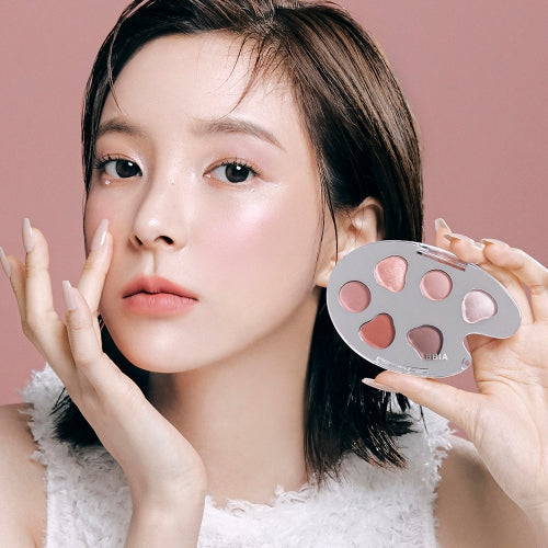 Woman showcasing BBIA Last Eye Palette with soft, natural eye makeup look.