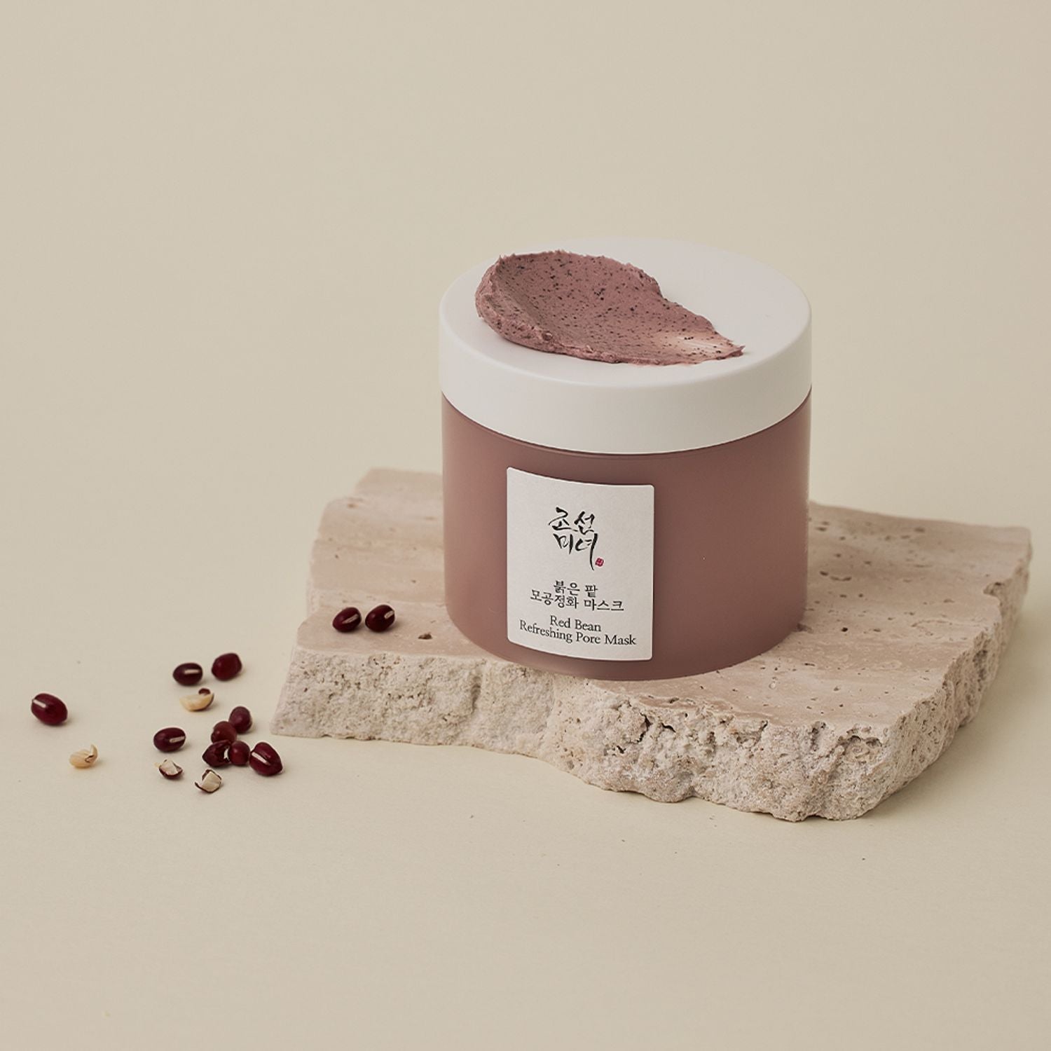 BEAUTY OF JOSEON Red Bean Refrshing Pore Mask 140ml on stone surface with red beans