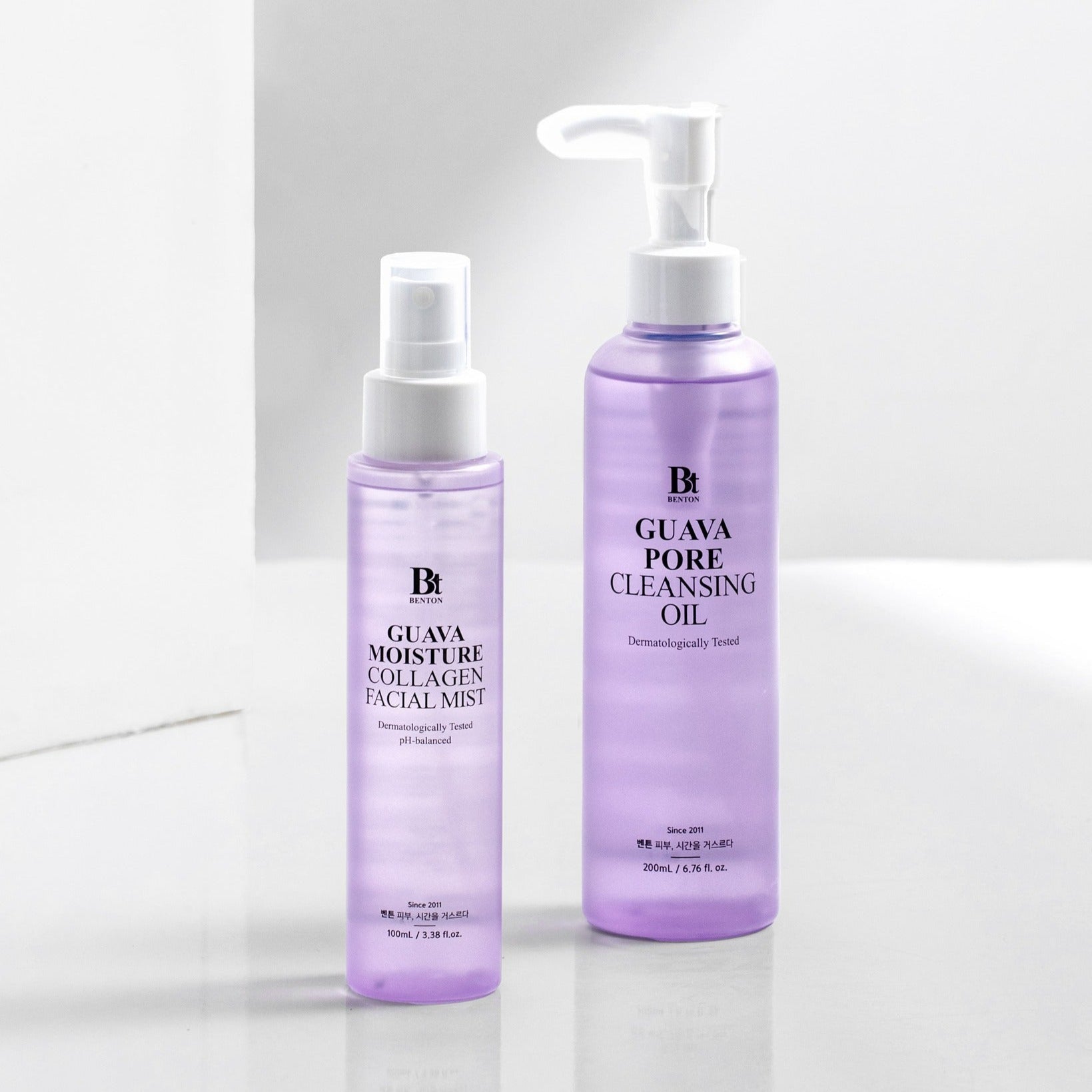 BENTON Guava Hydrating Collagen Mist 100ml bottle next to a cleansing oil bottle on a white background