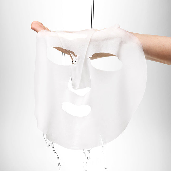 BEPLAIN B5 Hydrating Ampoule Mask 5 Sheets draping over a hand, showcasing its smooth and hydrating texture.