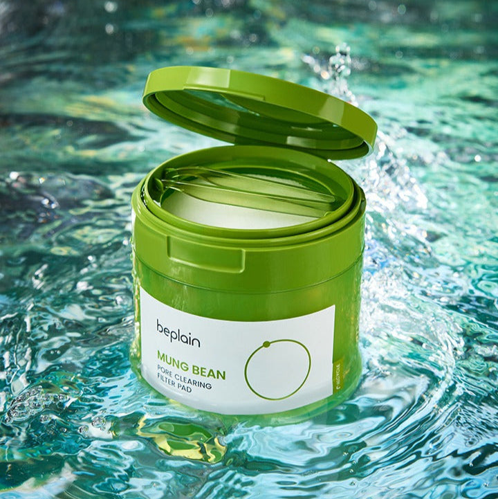 BEPLAIN Green Bean Pore Clearing Filter Pad 70 Sheets in open green container against water background.