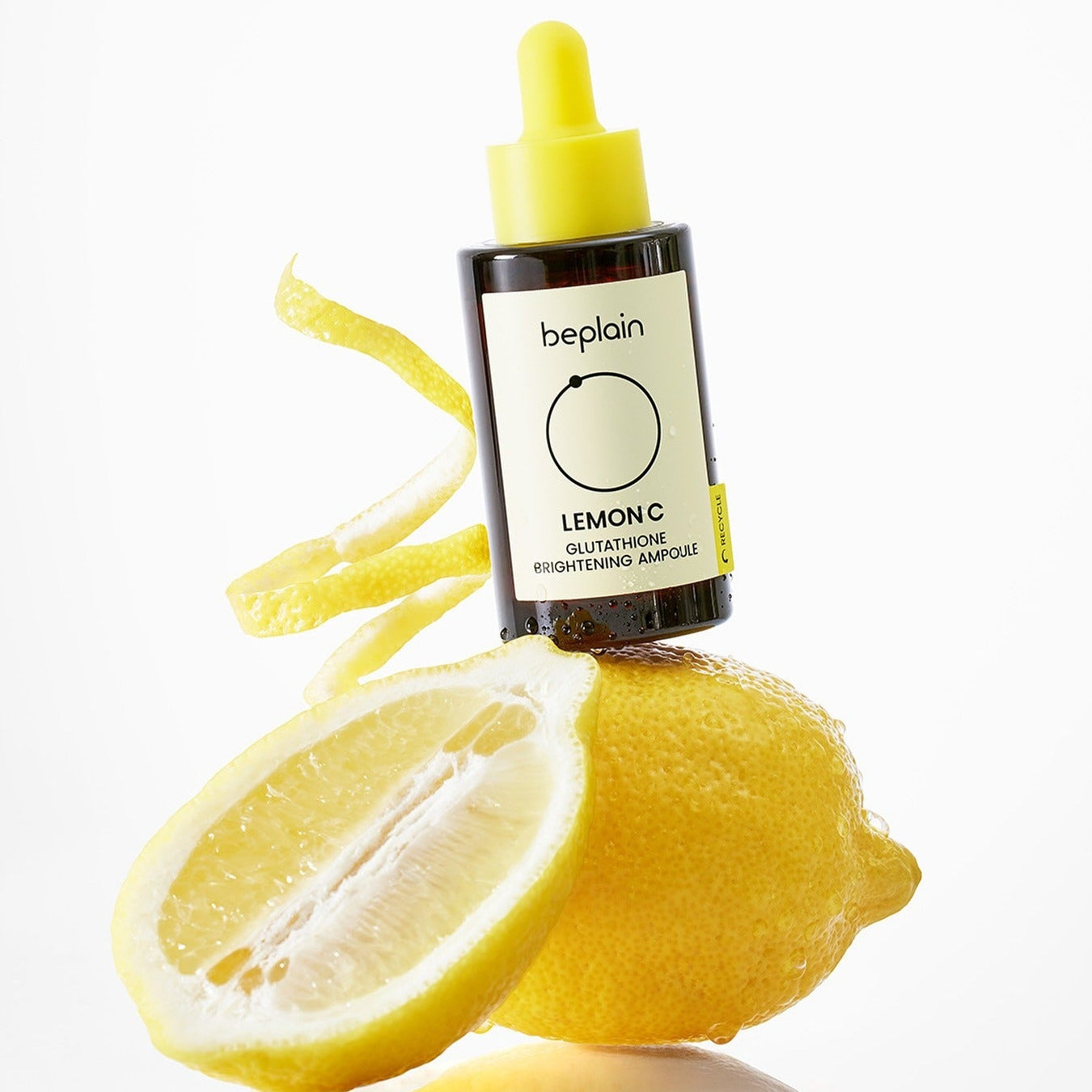 BEPLAIN Lemon Seed Glutathione Whitenning Ampoule 30ml bottle with fresh lemon backdrop