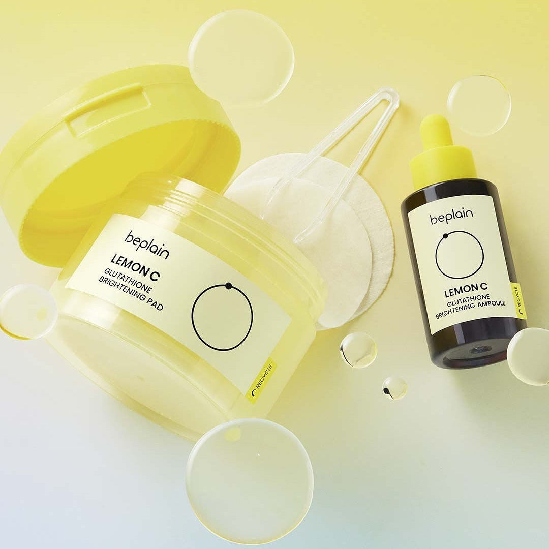 BEPLAIN Lemon Seed Glutathione Whitenning Pads 70 Sheets shown with yellow packaging and liquid bottle on light background.