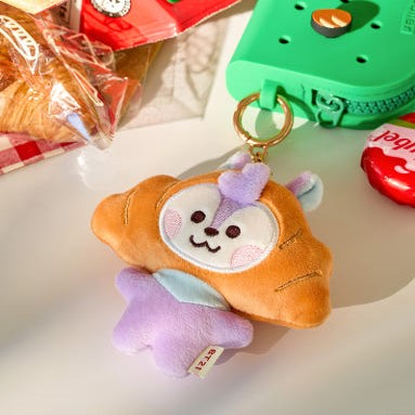 BT21 Bakery Plushy Keyring en forme de croissant mignon, parfait pour les amateurs de pâtisseries et de produits BT21.