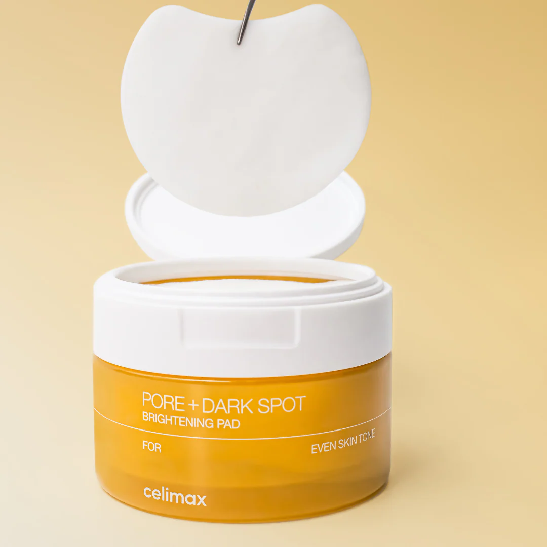 CELIMAX Pore Dark Spot Brightening Pad 40ea open jar with pad on yellow background for even skin tone