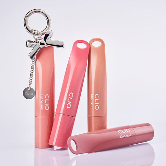 CLIO Glaze Lip Serum tubes and keychain displayed on a white surface