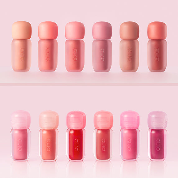 Assorted shades of CLIO Volume Mate Blur Tint/Gloss displayed in sleek packaging on a light pink background.