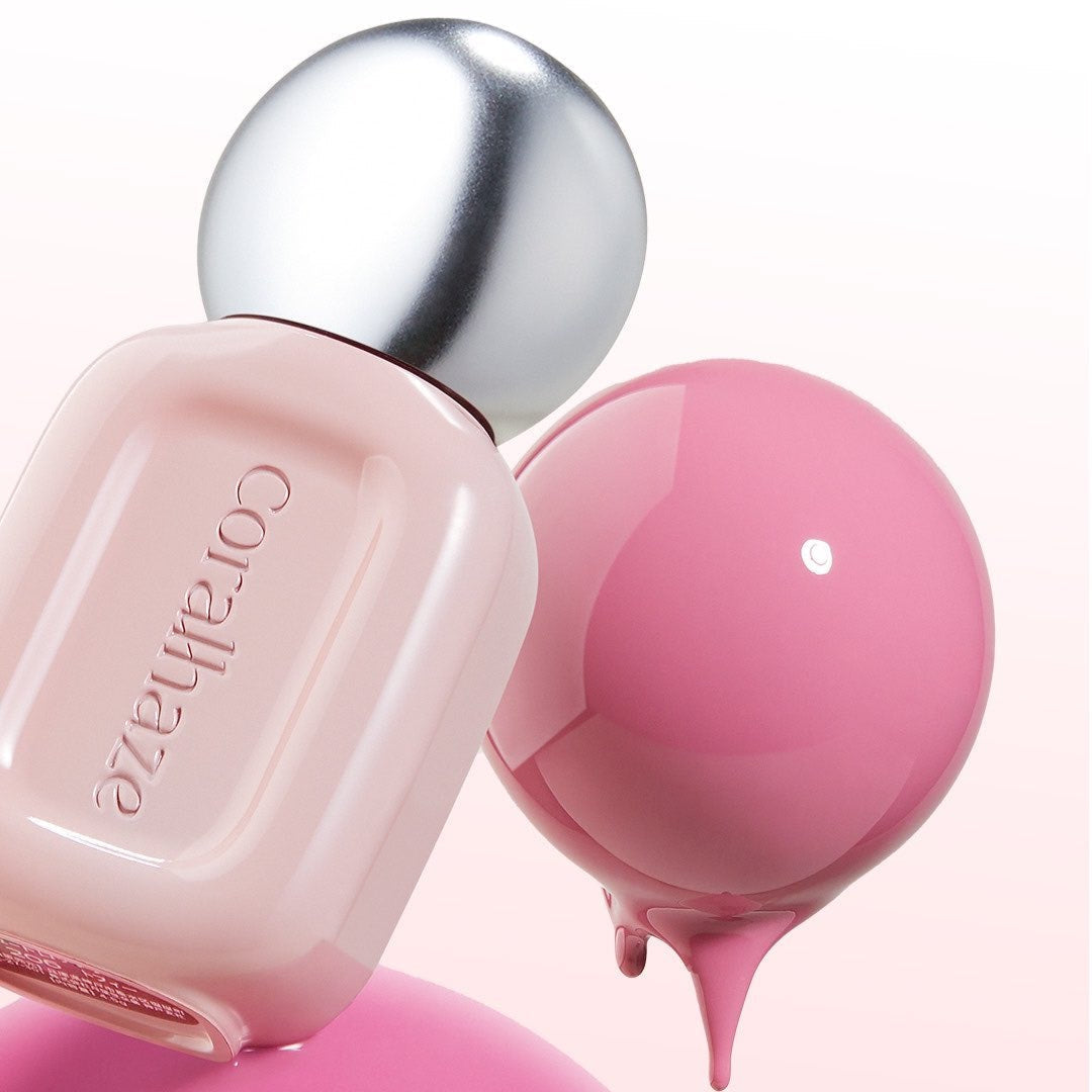 CORALHAZE Dew Drop Tint 4.5g bottle with pink tint droplet on a reflective surface.