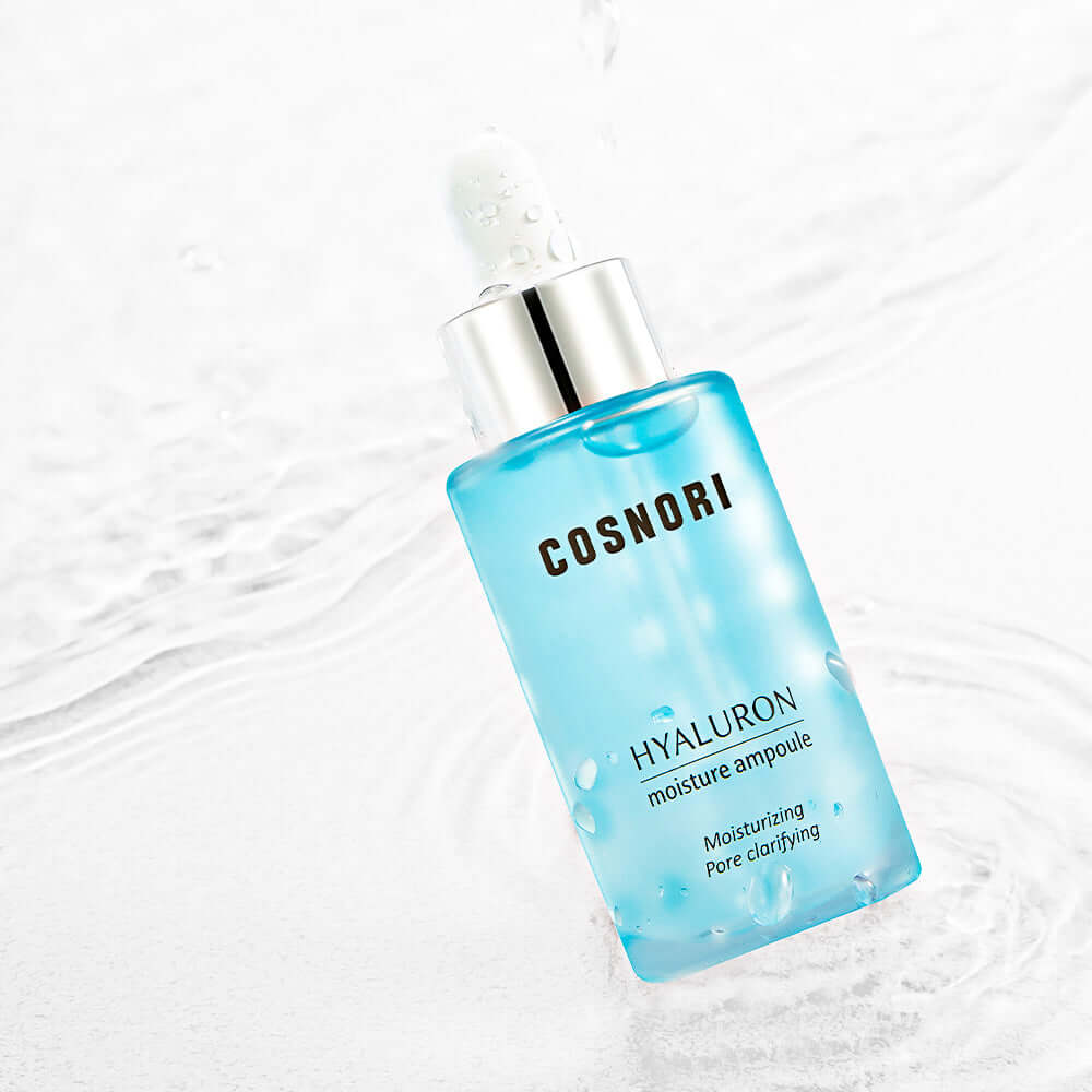 COSNORI Hyaluronic Moisture Ampoule 30ml with hydrating formula and sleek packaging on a water-themed background.