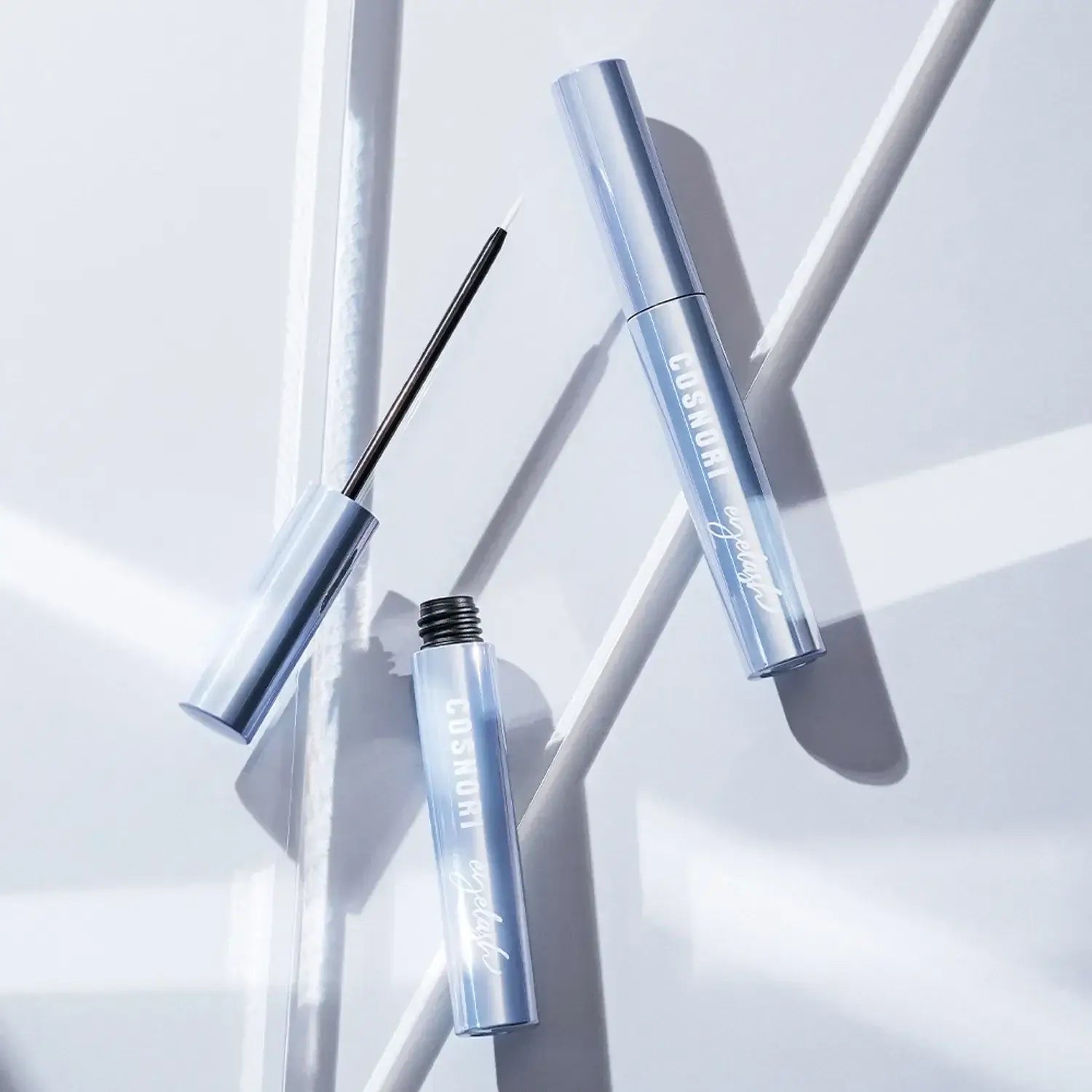 COSNORI Intensive Eyelash Serum bottle and applicator on a white background.