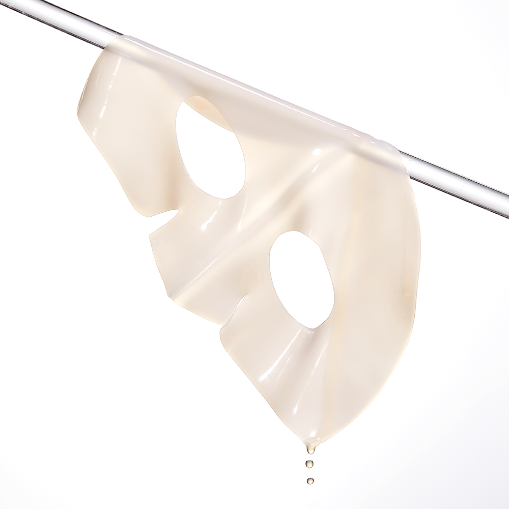 COSRX The Alpha-Arbutin Discoloration Care Hydrogel Mask (3EA) hanging to show hydrogel texture