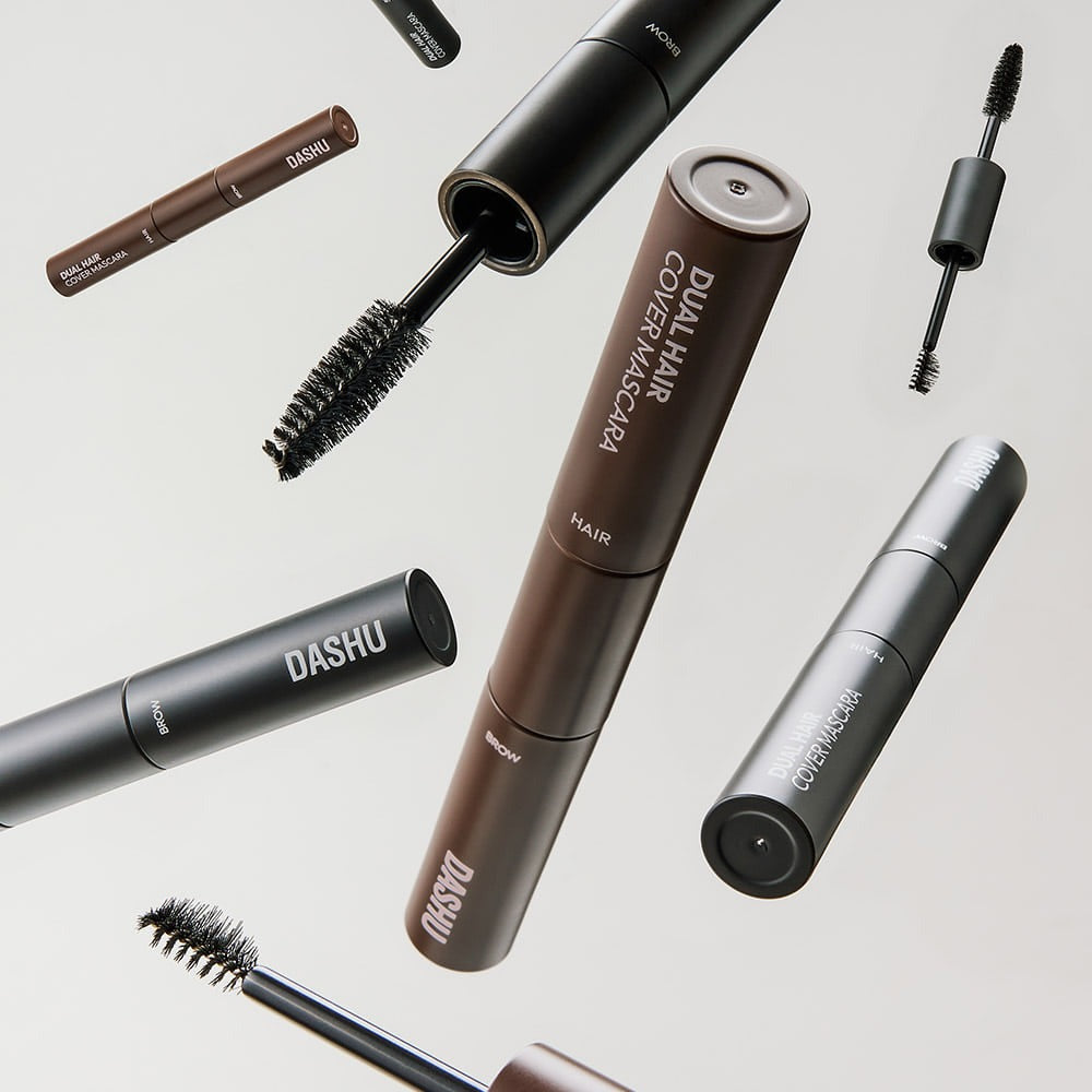DASHU Daily Dual Hair Cover Mascara displayed with various brushes for hair application.