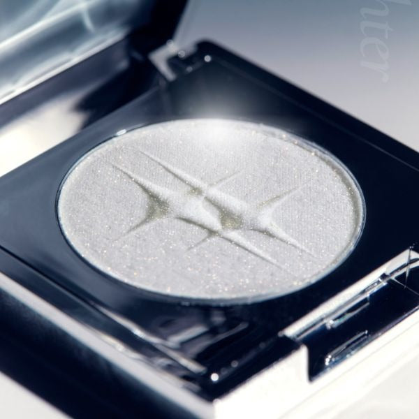 DINTO Polaris Shine Highlighter in sleek packaging showcasing a shimmering glow.