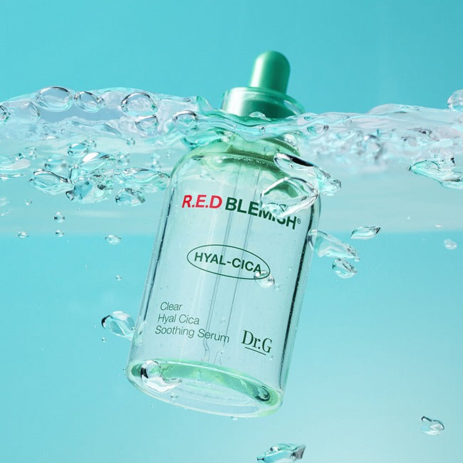DR.G Red Blemish Clear Hyal Cica Soothing Serum 50ml bottle submerged in water showing label and green dropper