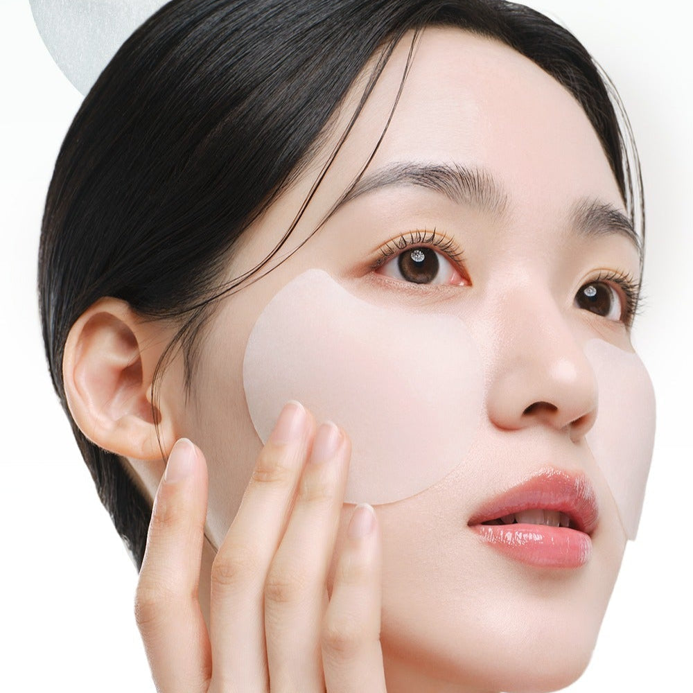 Woman applying DR.G Red Blemish Turnip Cica Icying Pads 60 Sheets to her cheek, showcasing the skincare product in use.