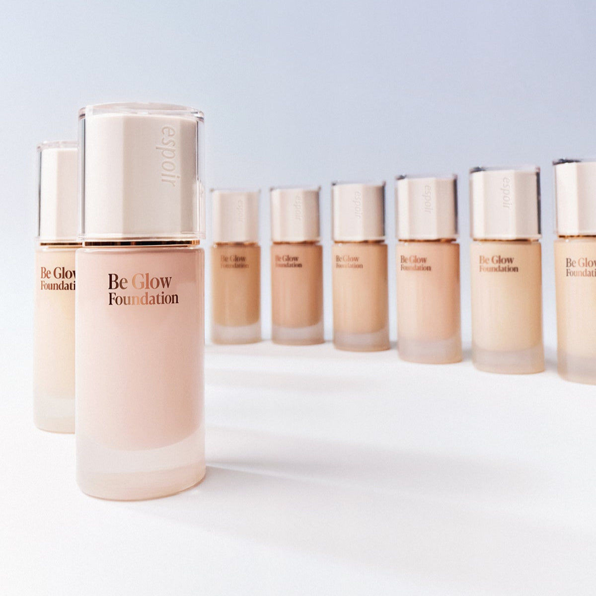 ESPOIR BE GLOW FOUNDATION SPF27 PA++ bottles in various shades. Enhance your skin's radiance with this premium foundation.