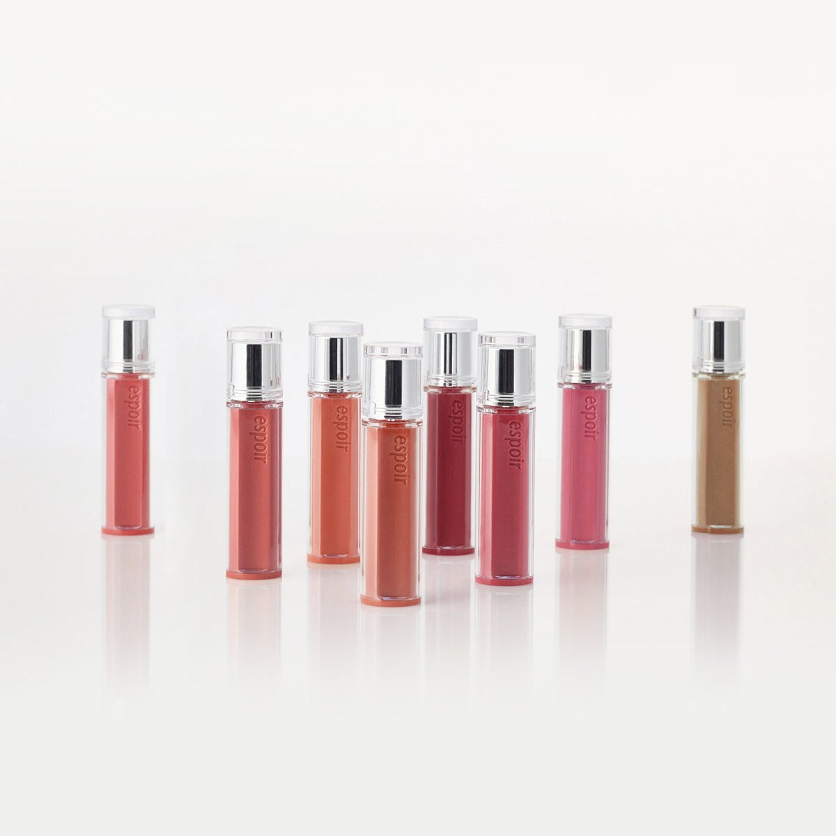ESPOIR Couture Lip Tint Glaze collection in various shades displayed in tubes