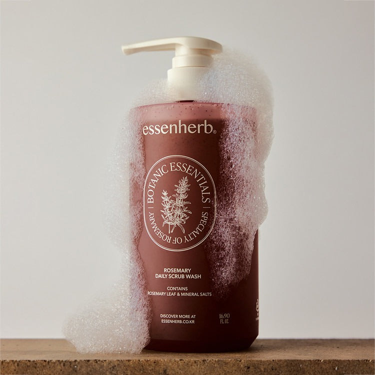 ESSENHERB Rosemary Daily Scrub Wash 500ml with foamy texture on wooden surface